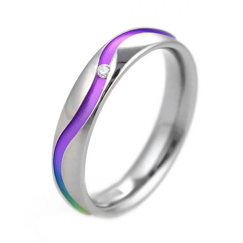 Hypoallergenic rainbow titanium ring with single diamond.